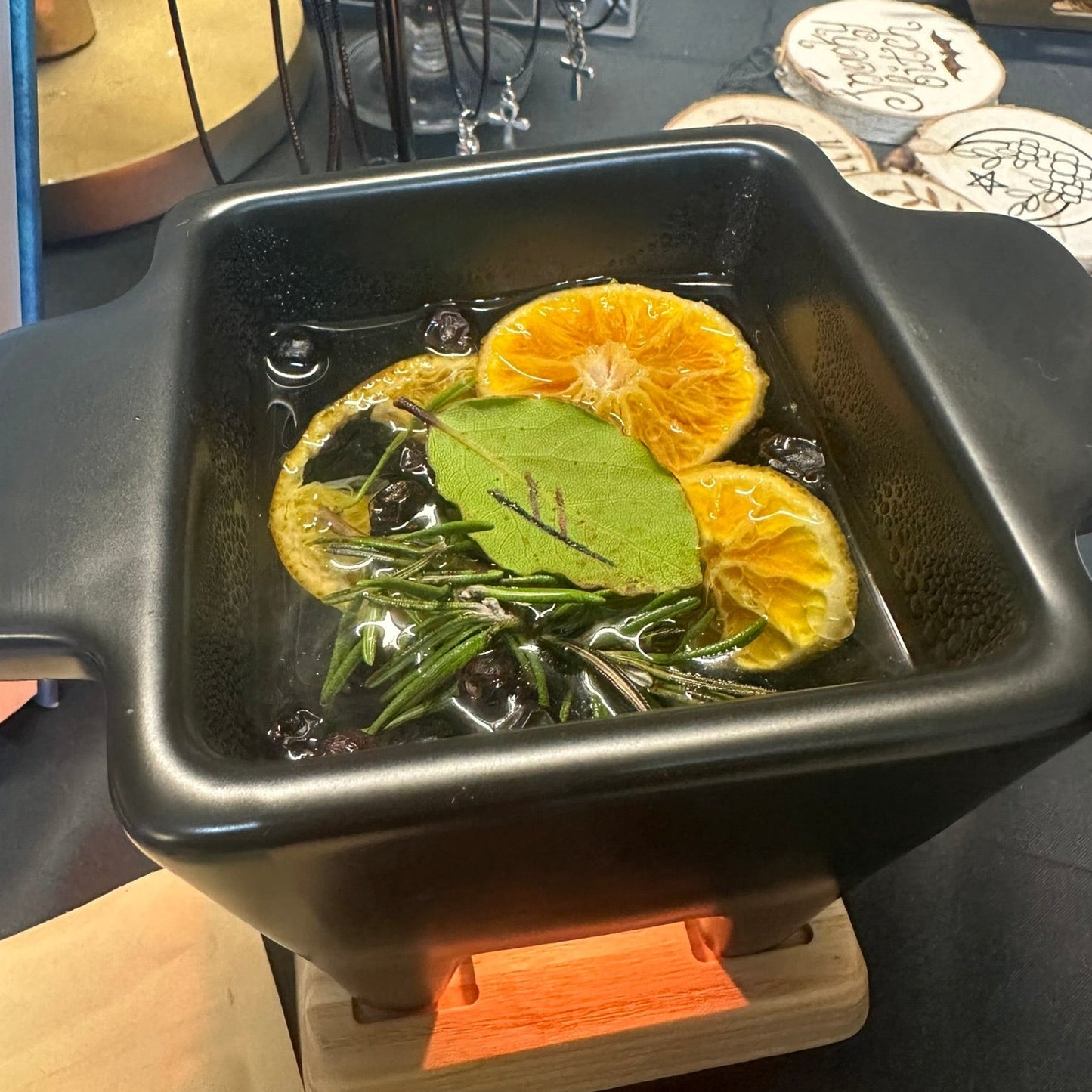 Simmer Pot for witches - Black squared cauldron shape with a wooden base.